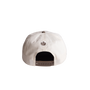 White cap with a logo on the back against a white background