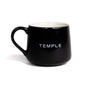 Black mug with 'TEMPLE' text on a white background