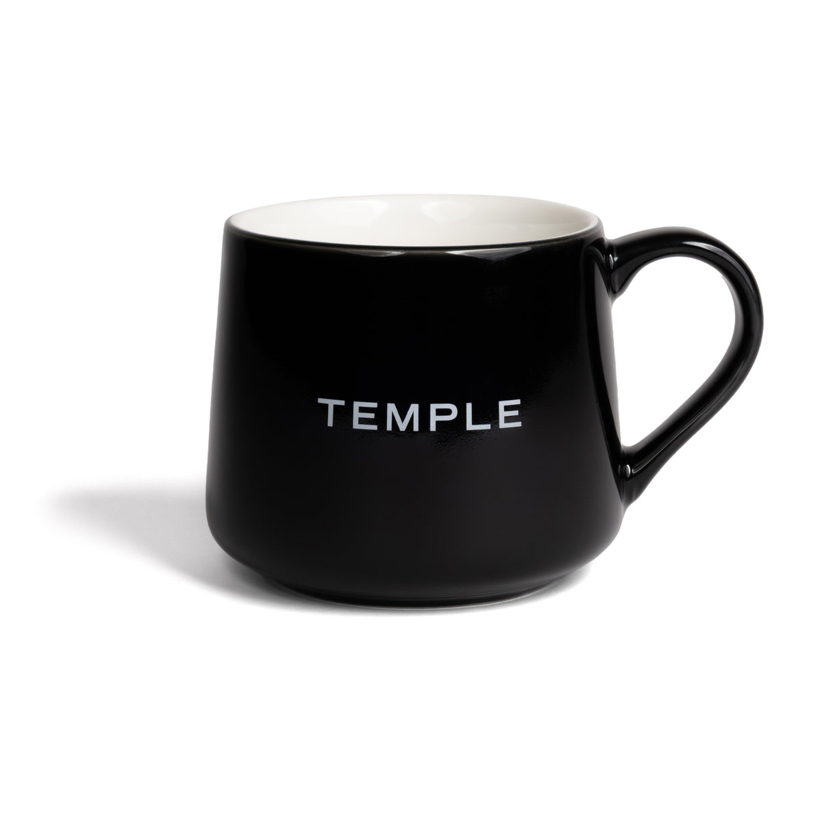 Black mug with 'TEMPLE' printed on a white background