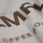 Close-up of a brown logo on a white background