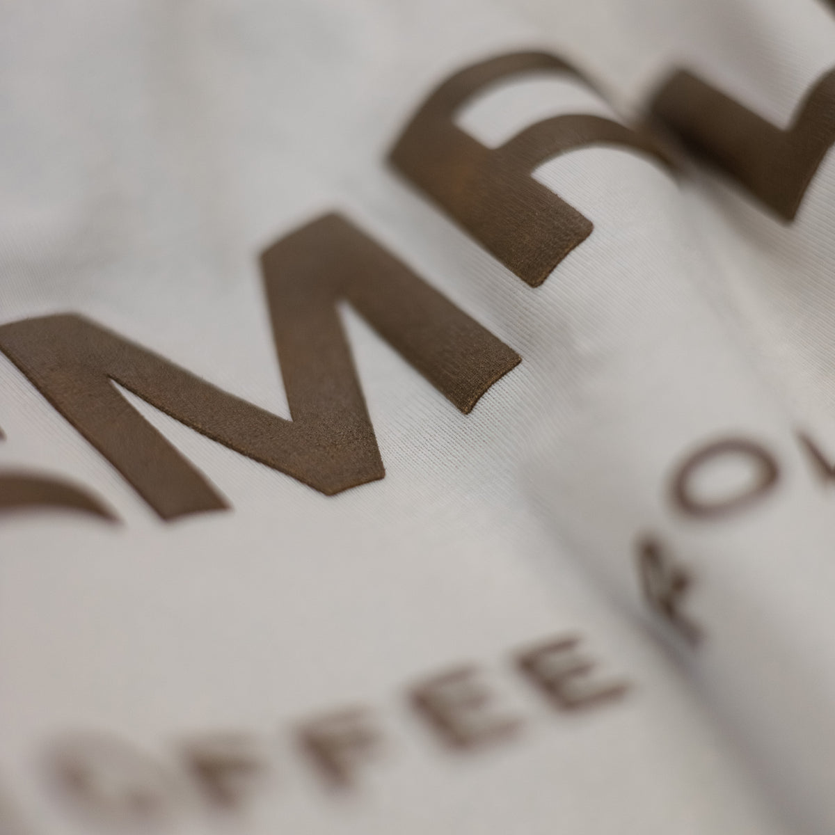Close-up of a brown logo on a white background