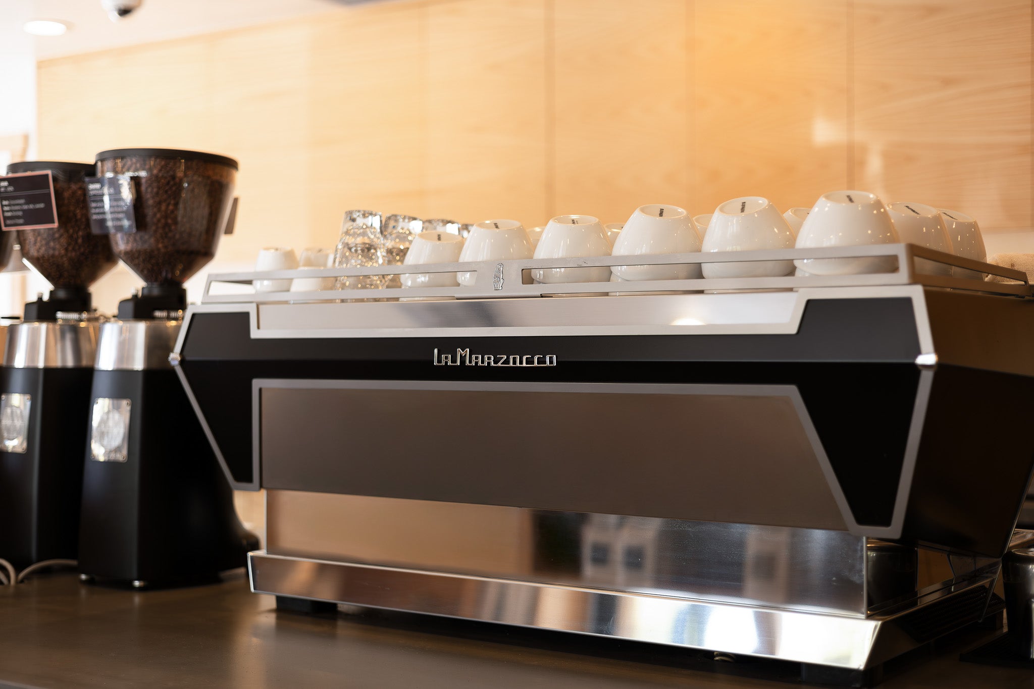 La Marzocco coffee machine on a counter with blurred background