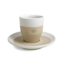 Ceramic cup with a beige base and white top on a matching saucer against a white background