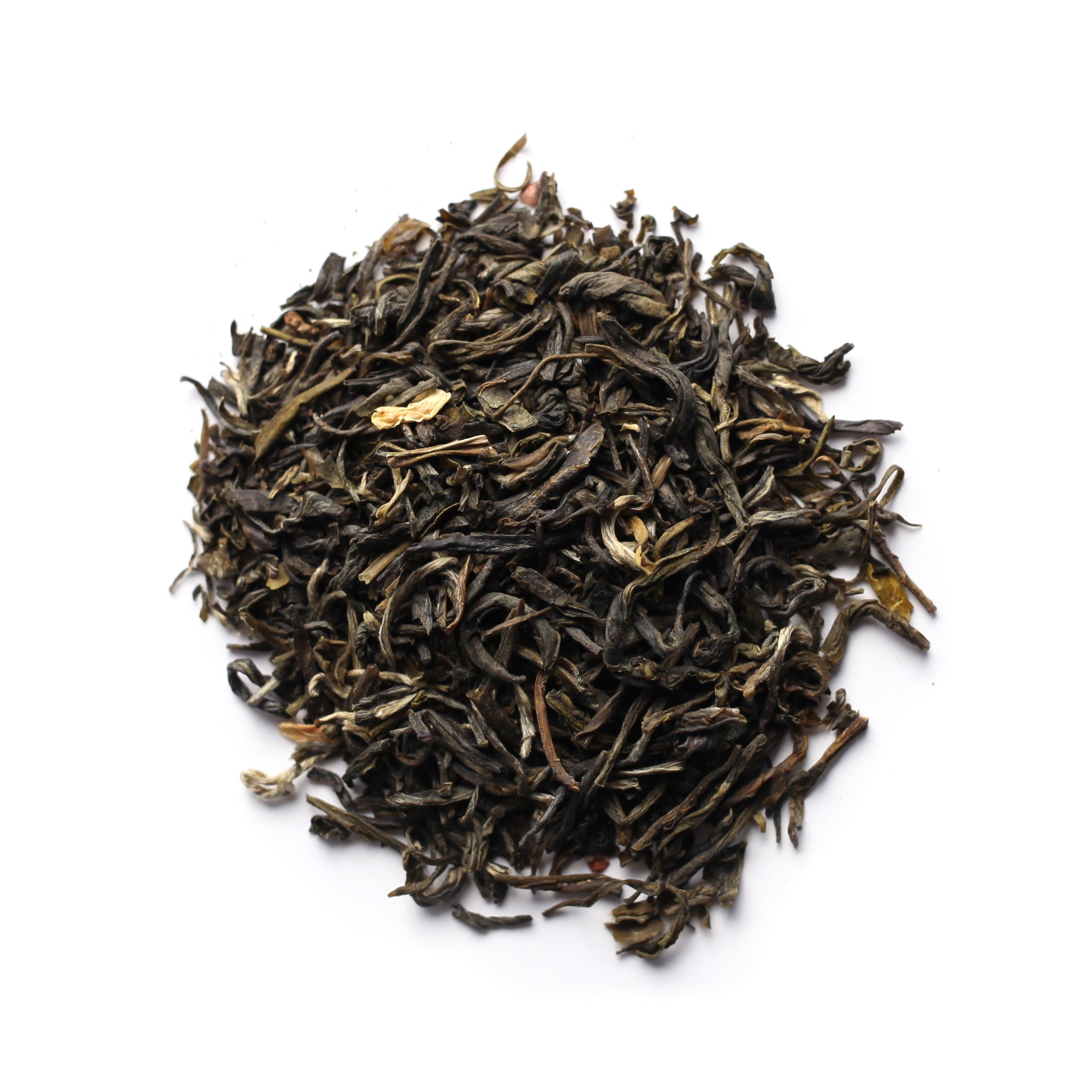 A pile of green tea leaves with visible jasmine blossoms interspersed among them.